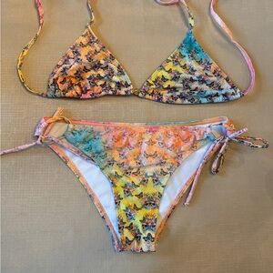 Tie side triangle top full coverage bottom swimsuit swim floral w/ skulls suit